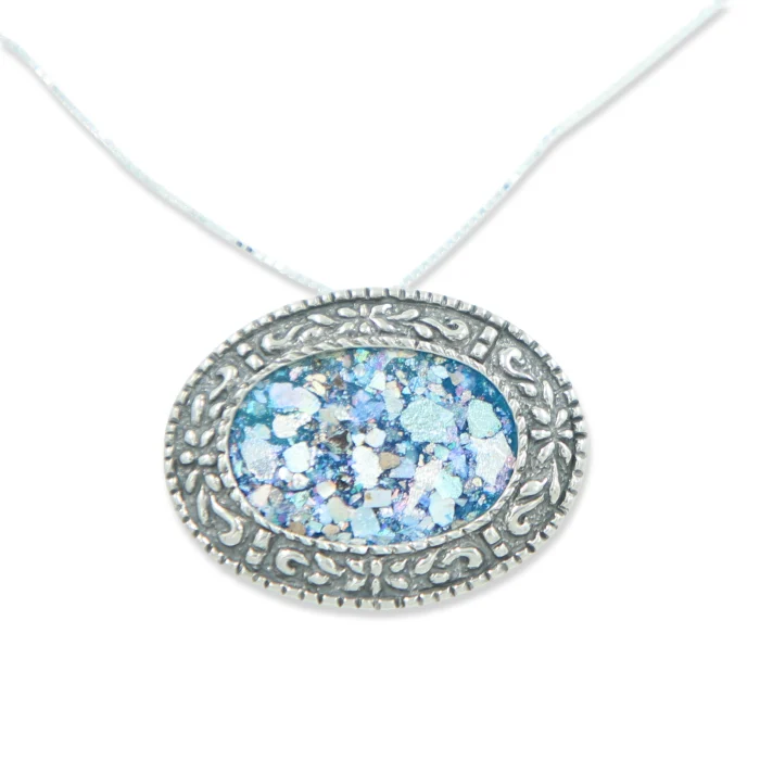 Pendant - Roman glass fragment set in 925 Stirling silver Oval with intricate design.  Can be worn vertically or horizontally